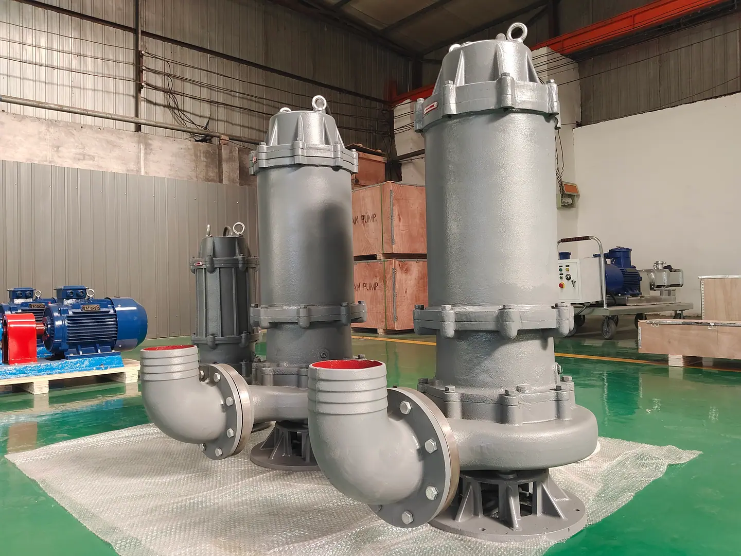 Silver sewage pump equipment in a workshop