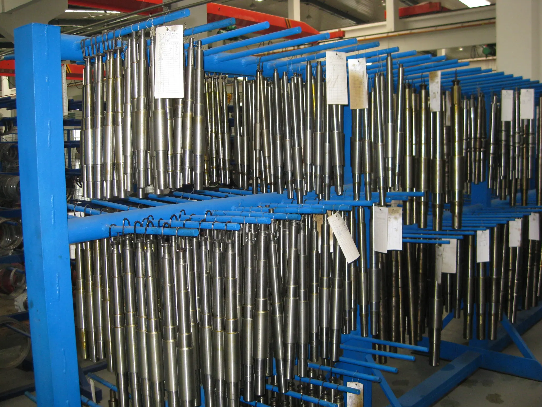 Shaft components stored on workshop racks