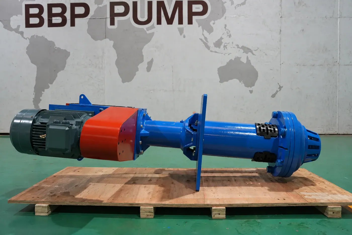Illustration of a vertical sump slurry pump laid horizontally on a pallet with its motor attached
