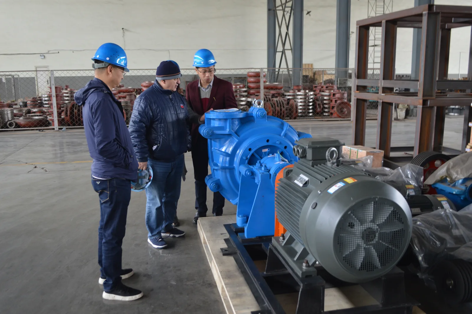 Visitors reviewing equipment in the workshop